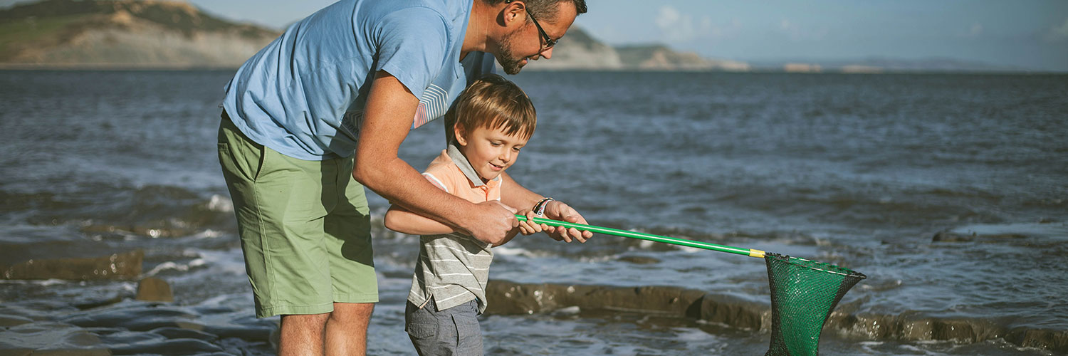 Father and son with fishing net