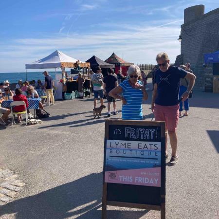 Gun Cliff walk at sunset, with A board advertising Lyme Eats Boutique