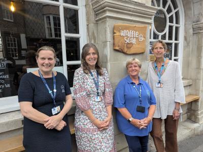 Weldmar Hospicecare staff standing outside Waffle Lyme Regis 