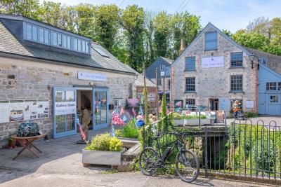 sun lit photograph of the town mill building complex