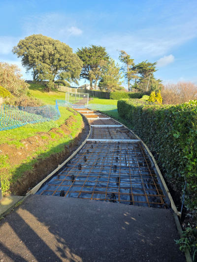 Floating concrete rafts during construction of new paths in the gardens