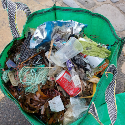 a sack full of rubbish collected from Lyme Regis beach