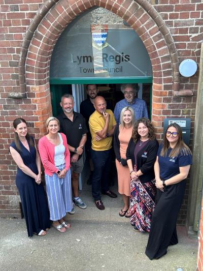 Lyme Regis Town Council staff stood in the doorway of the new office 