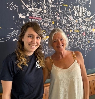 group volunteer Anna, right, with waffle volunteer