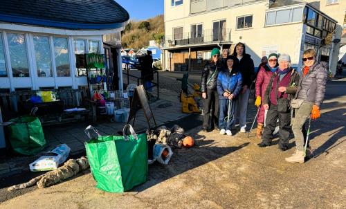 local beach clean volunteers outside the RNLI shop