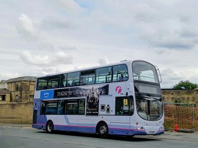 a photo of a first bus double decker in lyme regis