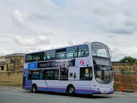 a photo of a first bus double decker in lyme regis