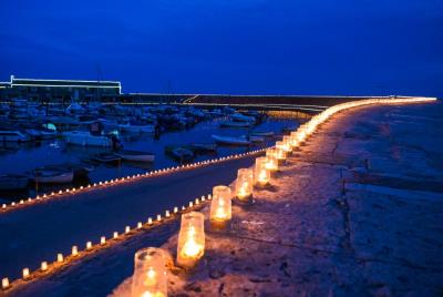 Tealights on the historic Cobb in Lyme Regis as part of the Candles on the Cobb event