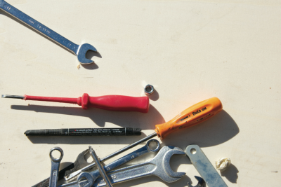 a picture of various tools laid out on a work bench