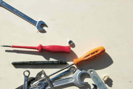a picture of various tools laid out on a work bench