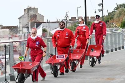 Red Barrows performing on Marine Parade Shelters Roof in Lyme Regis
