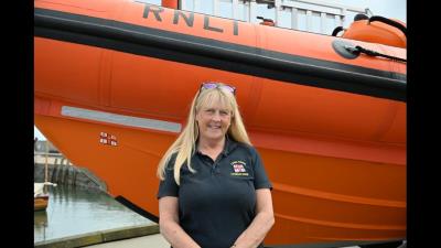 Petrina Muscroft with Lyme Regis RNLIs Atlantic 85 inshore lifeboat Spirit of Loch Fyne