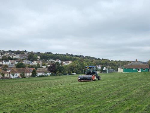Verti-Draining at Anning Road Playing Field tractor on the field