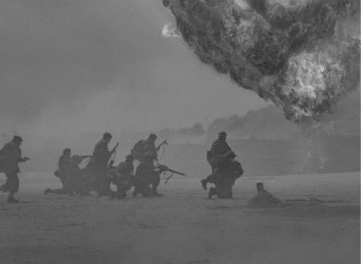 black and white image of armed soldiers on battleground with explosives going off in the background