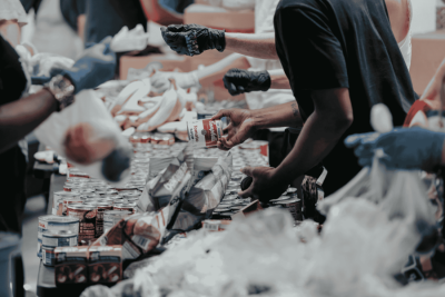 photo of people at a community supermarket shopping for items