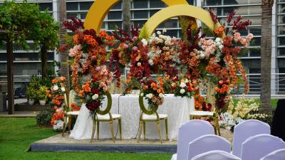 photo of a table outside with balloons cake and balloons for a wedding display