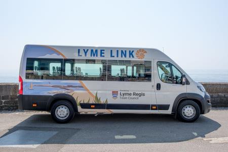 a photo of the Lyme Regis Lyme Link community bus photographed along Marine Parade